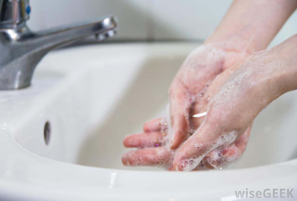 person-washing-hands-in-sink